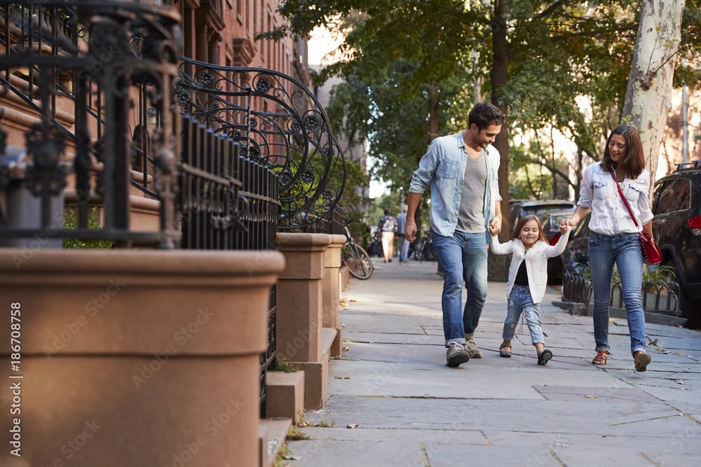 young family walking on the streets